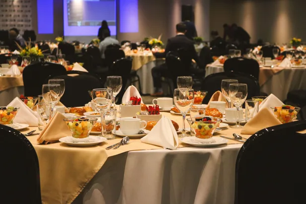 Banquet rounds set for a corporate event in a hotel ballroom