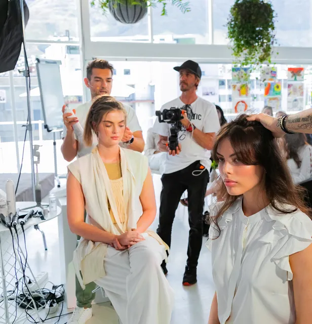 Hair stylist and photographer at work on a styled shoot